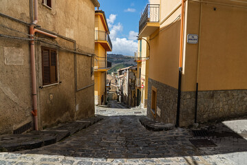 Caltavuturo, a historic Sicilian mountain town in the Madonie Mountains, featuring its medieval castle, charming narrow streets, and traditional stone houses, Sicily, Italy. Italian town in hills
