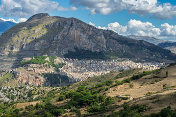 Fototapeta premium Caltavuturo, a historic Sicilian mountain town in the Madonie Mountains, featuring its medieval castle, charming narrow streets, and traditional stone houses, Sicily, Italy. Italian town in hills