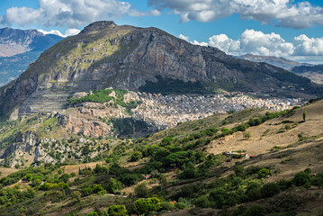 Fototapeta premium Caltavuturo, a historic Sicilian mountain town in the Madonie Mountains, featuring its medieval castle, charming narrow streets, and traditional stone houses, Sicily, Italy. Italian town in hills