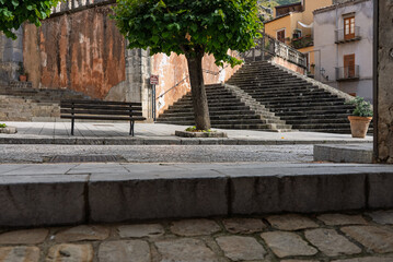 Obraz premium Collesano, a historic Sicilian mountain town in the Madonie Mountains, featuring narrow stone streets, traditional houses, and the Church of San Pietro, Sicily, Italy. Italian town in hills