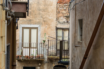 Collesano, a historic Sicilian mountain town in the Madonie Mountains, featuring narrow stone streets, traditional houses, and the Church of San Pietro, Sicily, Italy. Italian town in hills
