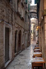 Fototapeta premium Charming narrow street in a historic stone town