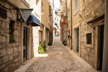 Charming cobblestone alley in a historic village during daylight hours