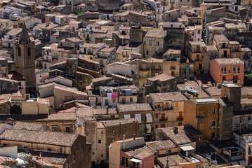 Fototapeta premium View of Isnello, a historic Sicilian mountain town in the Madonie Mountains, featuring charming narrow streets, traditional stone houses, and a Gothic church, Sicily, Italy. Italian town in hills