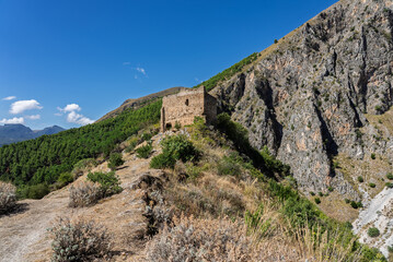 View of Isnello, a historic Sicilian mountain town in the Madonie Mountains, featuring charming narrow streets, traditional stone houses, and a Gothic church, Sicily, Italy. Italian town in hills