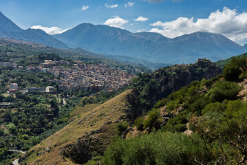 Fototapeta premium View of Isnello, a historic Sicilian mountain town in the Madonie Mountains, featuring charming narrow streets, traditional stone houses, and a Gothic church, Sicily, Italy. Italian town in hills