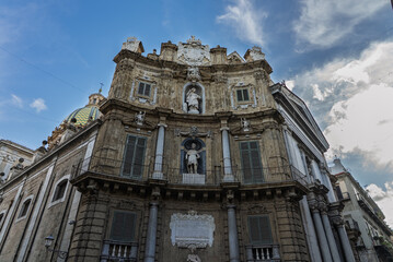 Fototapeta premium Palermo, the historic Sicilian capital city, featuring the monumental city gate, Palermo Cathedral, ornate baroque architecture, and charming narrow streets filled with history, Sicily, Italy
