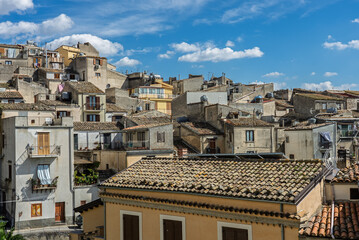 Polizzi Generosa, a picturesque Sicilian mountain town perched on rocky cliffs showcasing traditional stone buildings and panoramic views of the Madonie Mountains, Sicily, Italy
