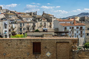 Polizzi Generosa, a picturesque Sicilian mountain town perched on rocky cliffs showcasing traditional stone buildings and panoramic views of the Madonie Mountains, Sicily, Italy