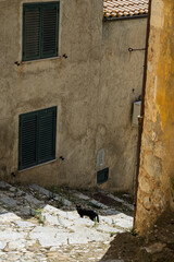 Fototapeta premium Sclafani Bagni, a small historic Sicilian mountain village perched on cliffs, featuring traditional stone houses, narrow streets, and panoramic views of the rugged Madonie Mountains, Sicily, Italy