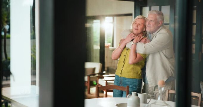 Love, talking and senior couple with hug in home for bonding, renovation planning or point to garden. Happy, elderly people and conversation with embrace for house improvement and retirement support