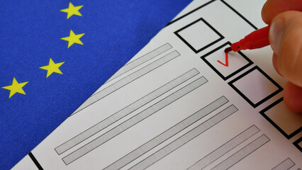 Person checks candidates box with red marker on paper ballot. Elections in EU. Blue flag with yellow stars background. Secure voting process ensures political stability, active citizen participation