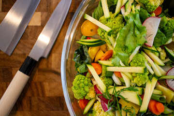 Fresh Vegetable Salad Preparation on Wooden Counter
