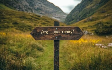 Are you ready? A rustic wooden signpost in an open field features the text about startup business success, preparation, planning to start, change, and action concept