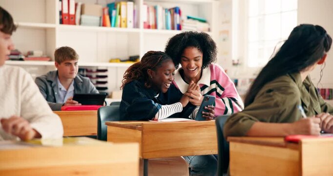 Happy, friends and students in classroom with phone for social media, online report or good news. High school, excited and girls on smartphone, website and app for education, results and success