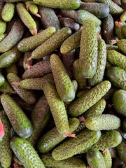 cucumbers in a market, vegetables background 