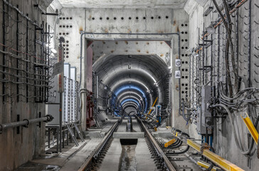 Underground Subway Tunnel Construction with Concrete Walls and Industrial Lighting