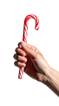 Mano sosteniendo bast&oacute;n de caramelo rojo y blanco detalle dulce tradicional de navidad