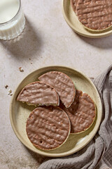 plate of rice galettes cakes cookies covered with milk chocolate