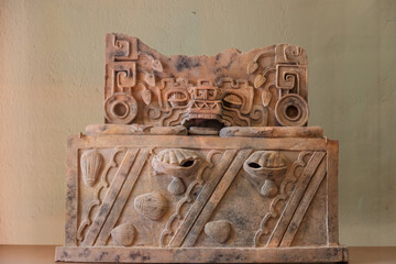 Pre-Hispanic Mexican ceremonial artifact with symbolic carvings – archaeological exhibit