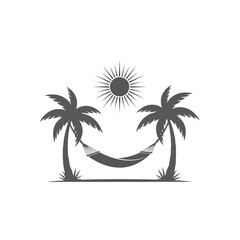 Silhouette of a hammock strung between two palm trees under a bright sun