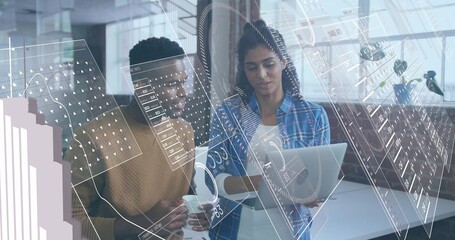 Coworkers wearing business attire analyzing digital overlays in office with laptop and coffee mug