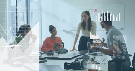 Discussing project strategy business professionals working in office, with VR headset and laptop