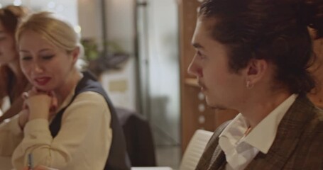 A diverse team of business professionals collaborates on a project in a modern office, demonstrating teamwork and innovation. - Powered by Adobe