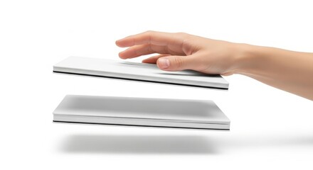Hand hovering over a floating tablet device on white background.
