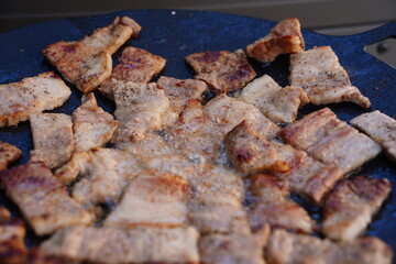 Sizzling Korean BBQ Pork Belly (Samgyeopsal) on a Hot Griddle