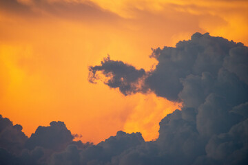 Dramatic sunset sky over Santa Cruz, Bolivia. Voluminous clouds illuminated by vibrant orange and deep gray tones, capturing the rich texture and atmospheric depth of a tropical evening. Part of a six