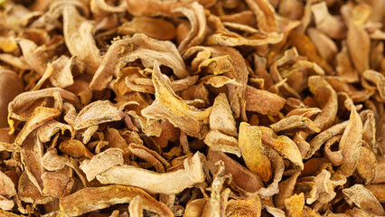 Sliced dried turmeric spice, curcuma longa, rhizomes roots