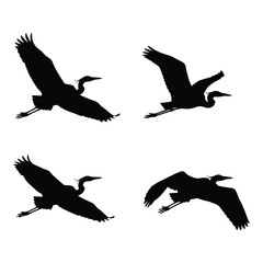 Four silhouette herons in flight majestic winged birds captured in dynamic poses perfect for nature and wildlife designs silhouette