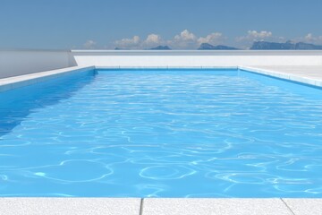 Empty pool, white deck, blue water, mountain view