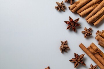 Cinnamon sticks and star anise on white background - aromatic spice display