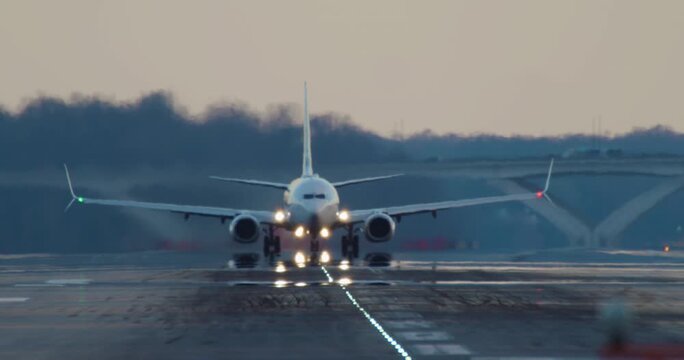 Blue Plane Takes off at Sunset with Camera Tilting to Follow 4k video