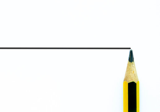 Horizontal ruled paper with a pencil tip at the edge, ample copy space for notes and clean minimal planning