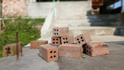 Red Clay Bricks for Construction on Cement Surface