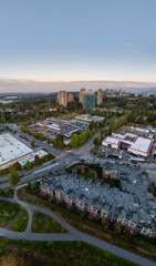 Aerial View Of New Westminster Suburban Cityscape With High Rise Buildings And Greenery