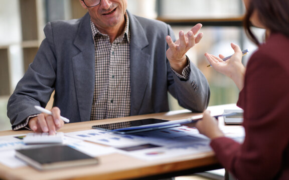 Business colleagues discussing financial analysis report