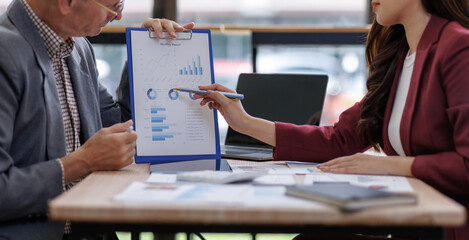 Business professionals analyzing financial report data