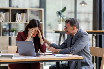 Stressed woman receiving empathetic support from colleague