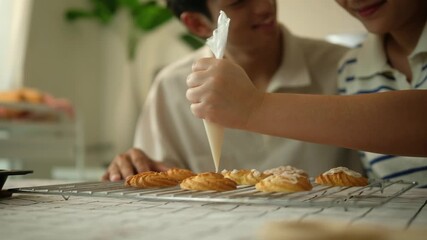 Homemade baking activity with a couple enjoying quality time, surrounded by fresh bread and a calm atmosphere. - Powered by Adobe