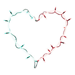Heart made with soft pastel Christmas lights creating a gentle romantic holiday feeling full of joy and warmth