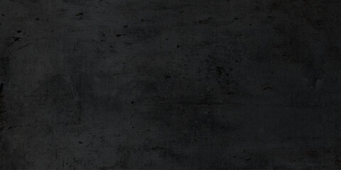 Fototapeta premium Dark black wall texture with rough surface details, perfect for backgrounds, interior design, and digital artwork, grunge concrete surface, black wall texture or grunge black board or chalk board.