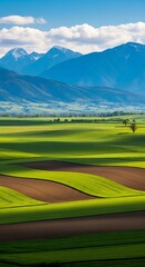 Scenic Landscape of Green Fields and Distant Mountains.