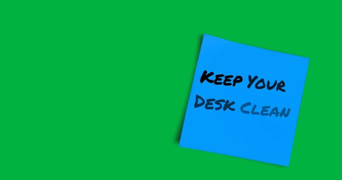 National Clean Your Desk Day promotes desk tidiness with a memo note on a black background. - Powered by Adobe