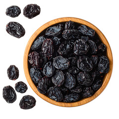 A wooden bowl overflowing with wrinkled, dark dried fruit, some scattered around it