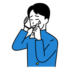 スマートフォンでの通話で泣く男子学生