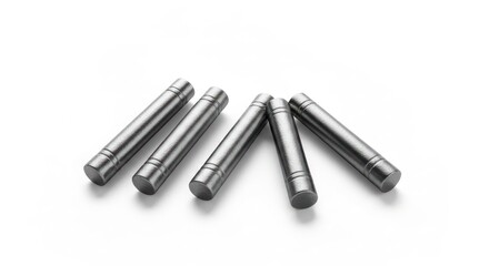 Naklejka premium Five metallic, cylindrical objects with grooved ends, arranged on a white surface